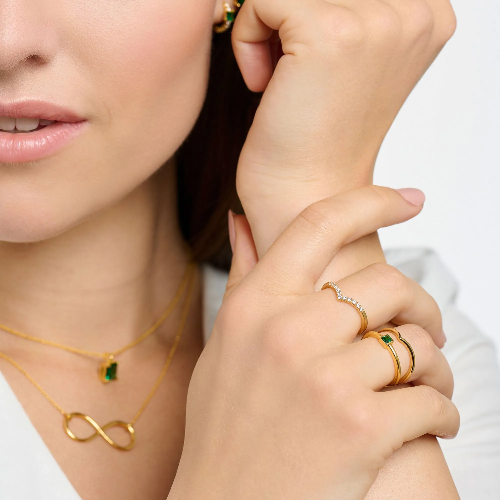 Thomas Sabo Damenring V-förmig mit weißen Steinen Gold