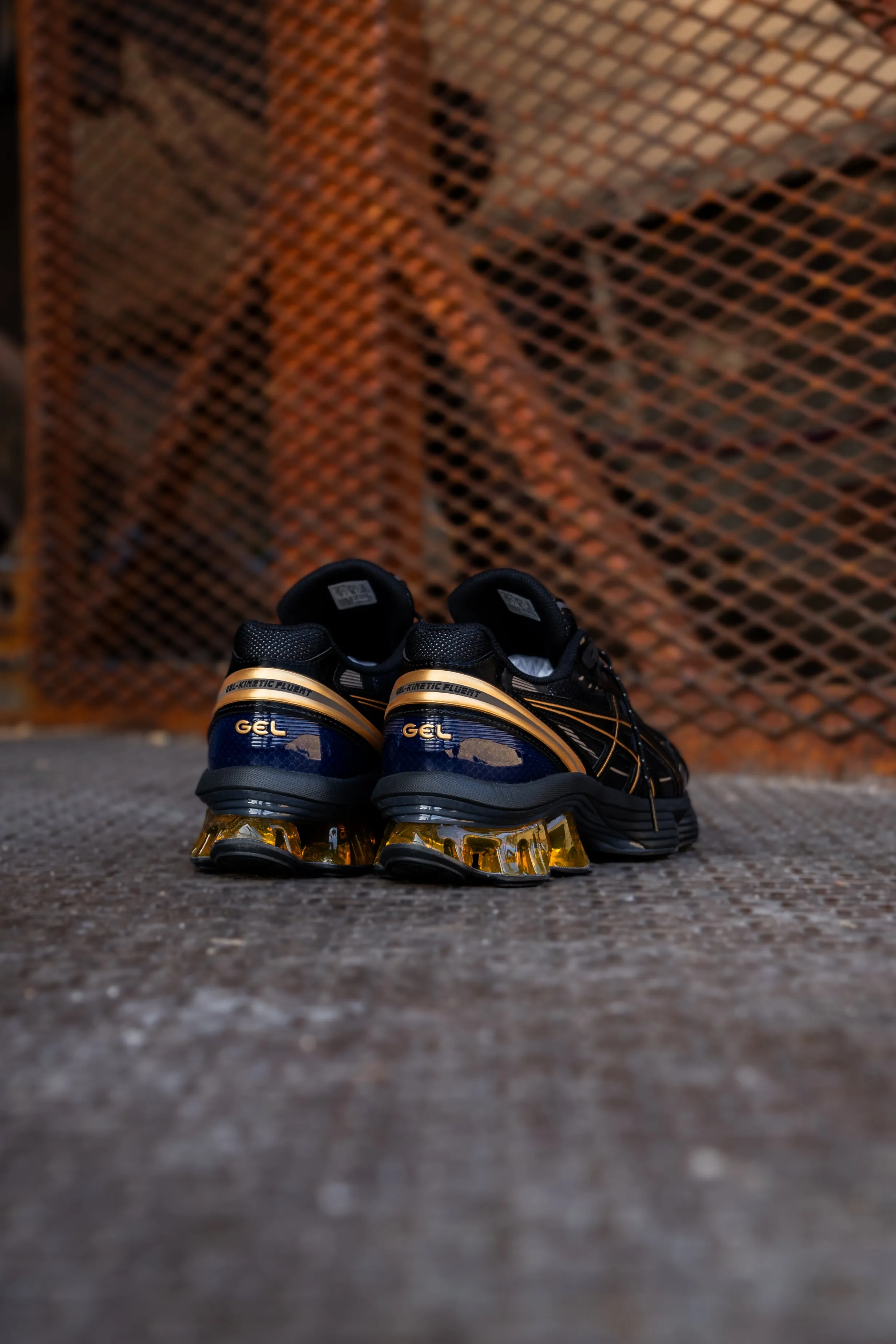 Herren Asics Gel-Kinetic Fluent (Schwarz/Gold)